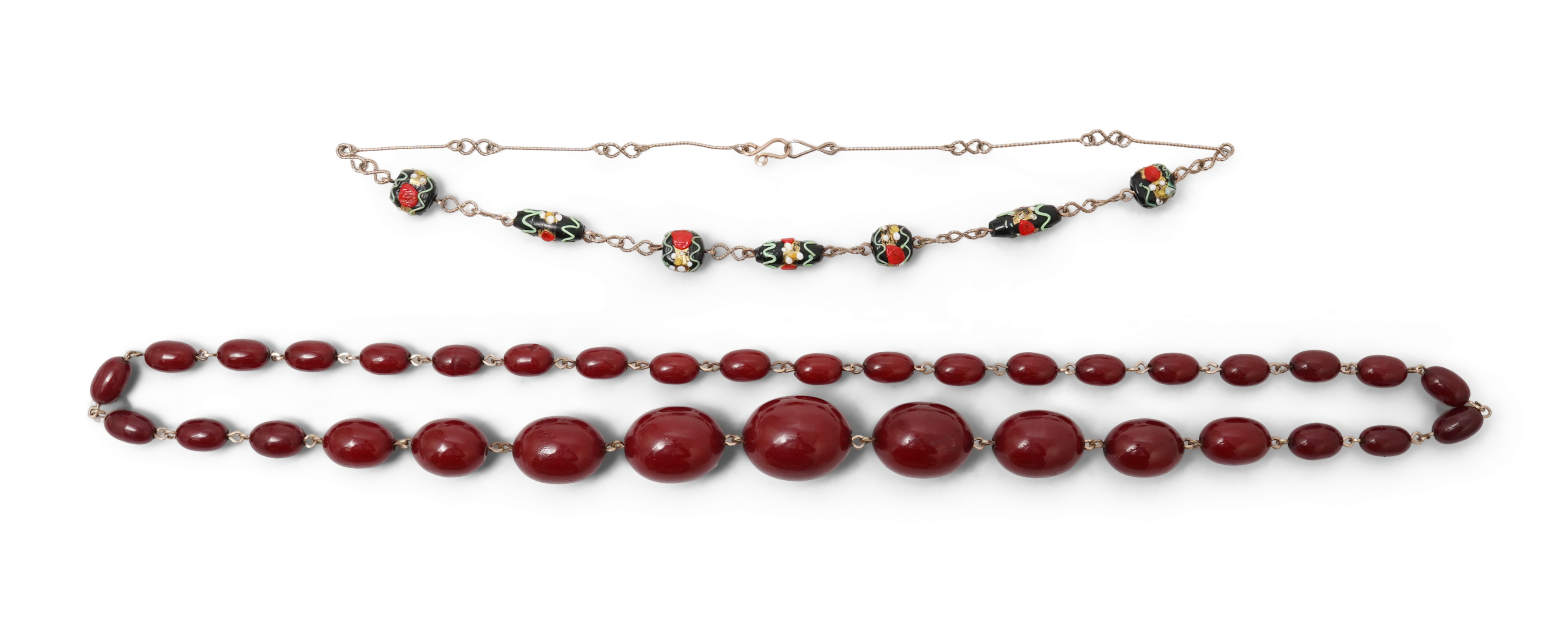 A cherry-coloured bakelite imitation amber necklace and a glass bead necklace